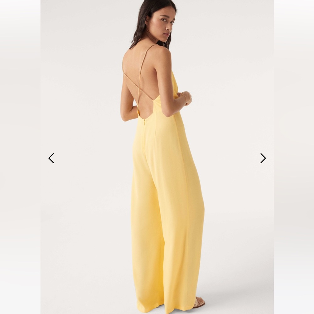 High-waisted jumpsuit with gold chain straps